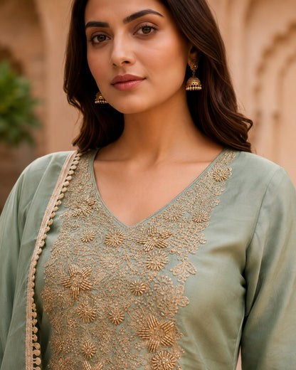 Hand embroidery detail on the yoke of the sage green kurta