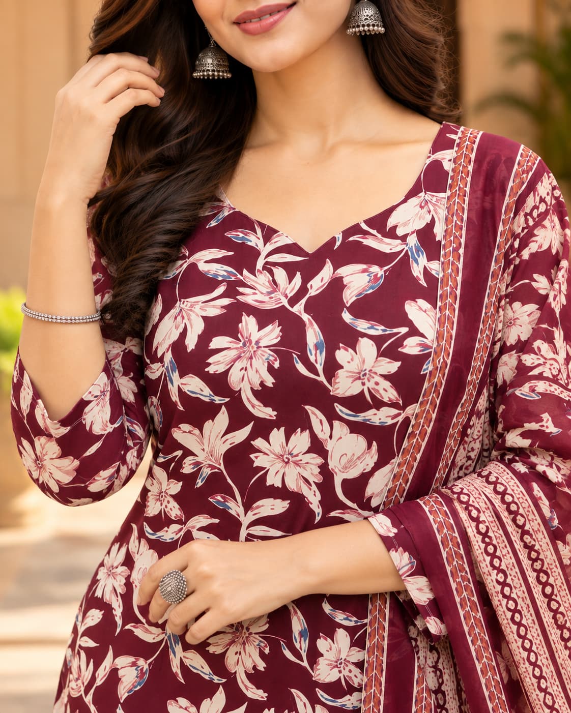 Floral print detail on a maroon cotton kurta