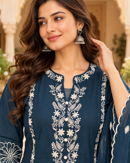 Ivory floral embroidery detail on a peacock blue kurta