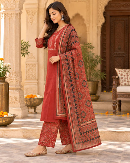 Embroidered paisley yoke with mirror work on a rust cotton kurta