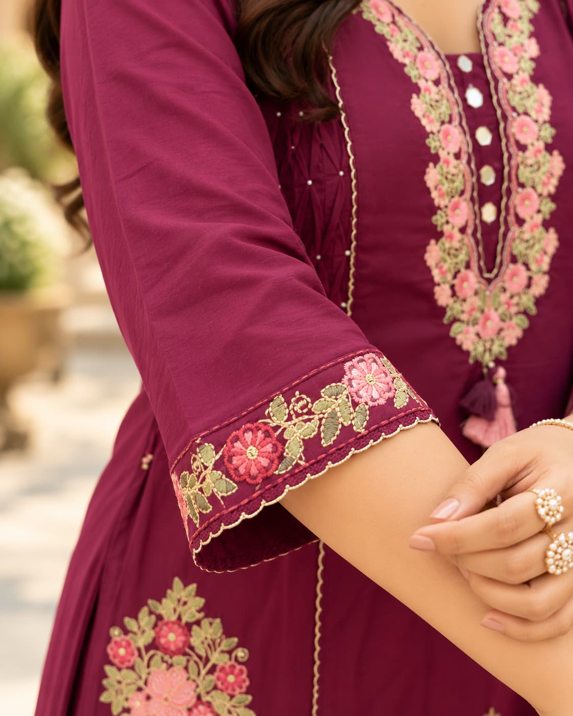 Matching wine pants with embroidered floral hems