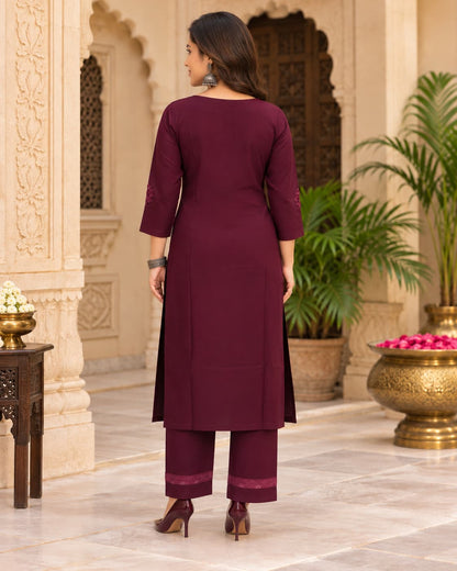 Chikankari-style floral embroidery detail on a wine kurta