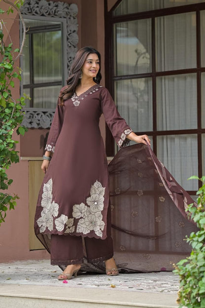 Close view of the floral yarn embroidery on the sleeve and hem of the Gulbahar chocolate brown cotton kurta