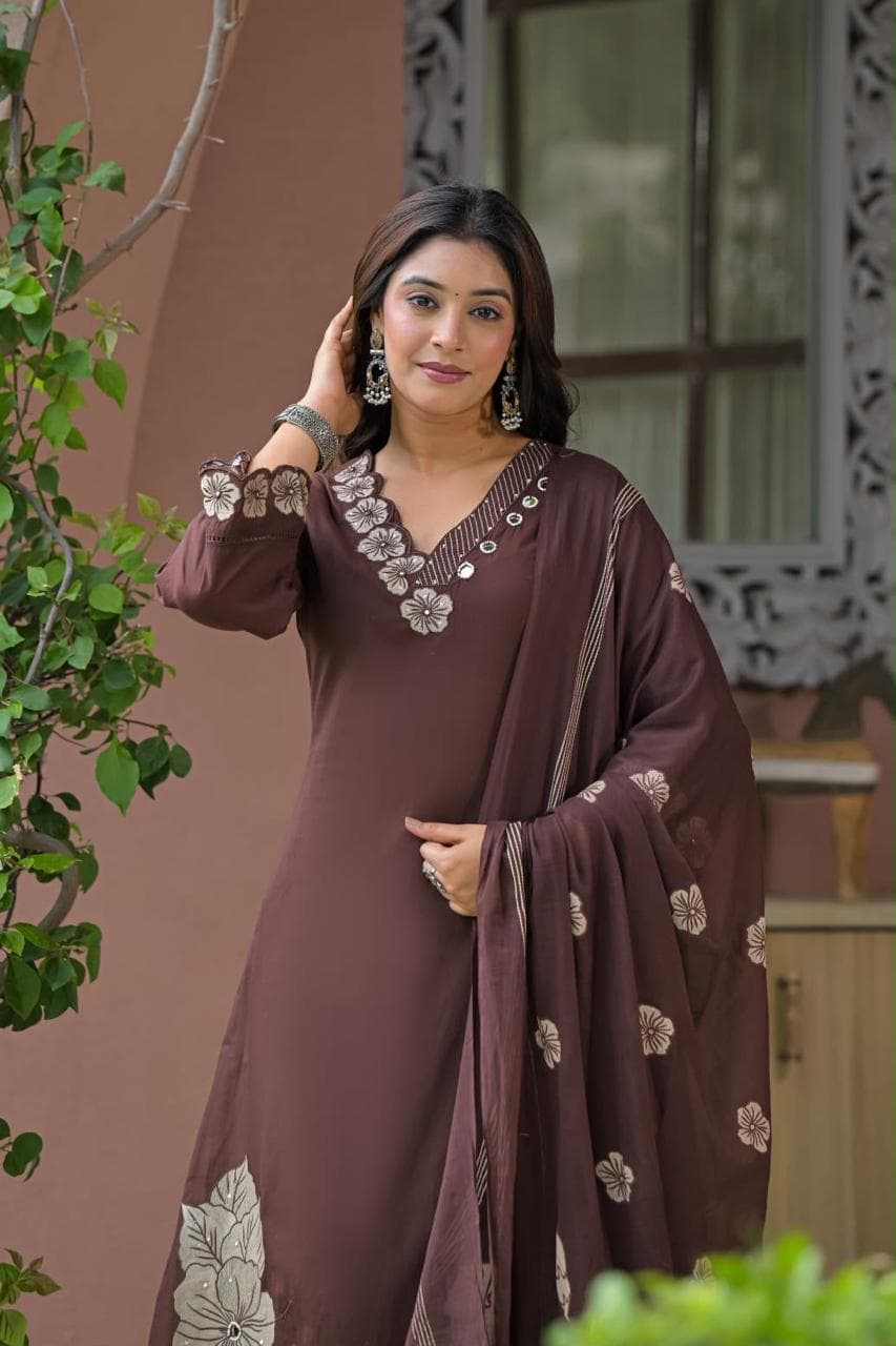 Brown embroidered cotton kurta set for women styled with coordinated straight-fit pants and lightweight floral dupatta